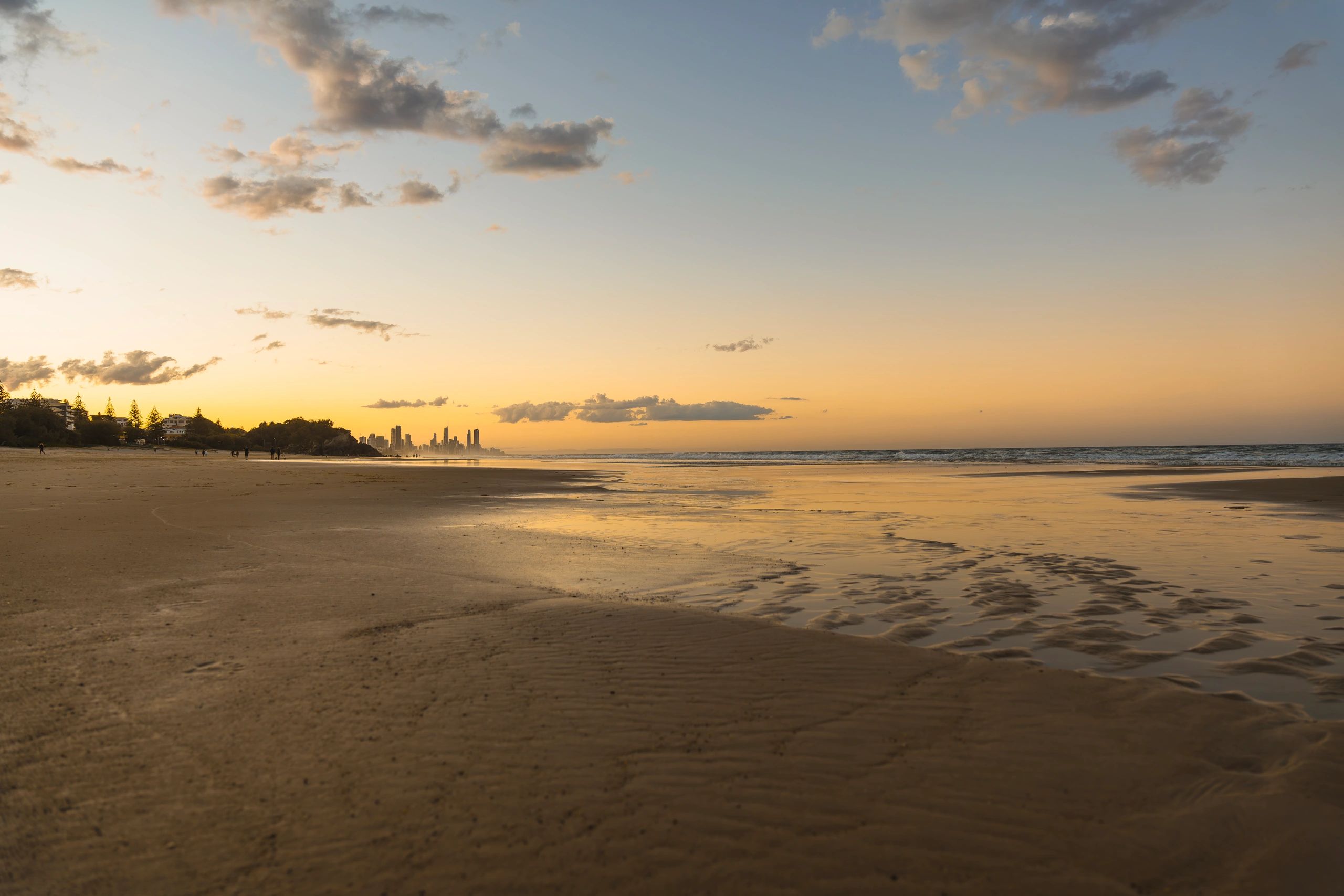 Wide shot of Burleigh Heads beach, Gold Coast, Queensland, Australia during sunset
