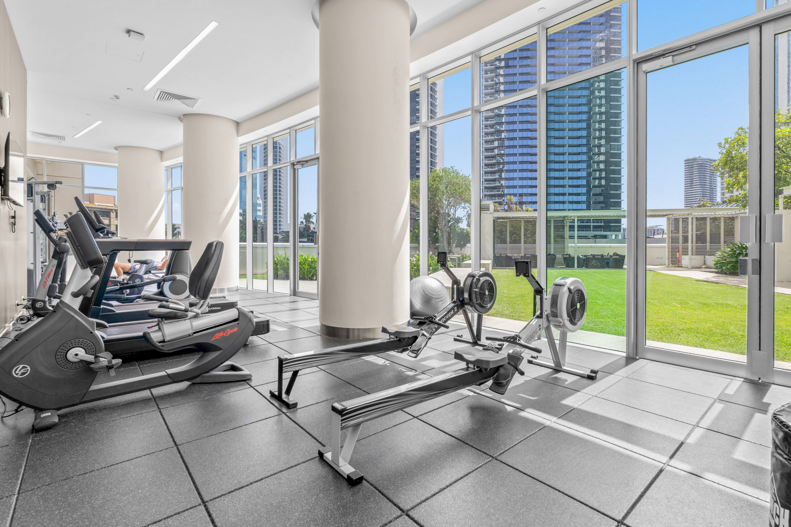Modern fitness room with city views